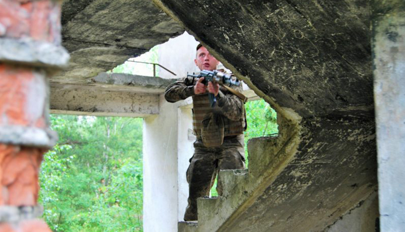 Lithuanian-Polish-Ukrainian Brigade clearing buildings of IEDs and mines in Ukraine.