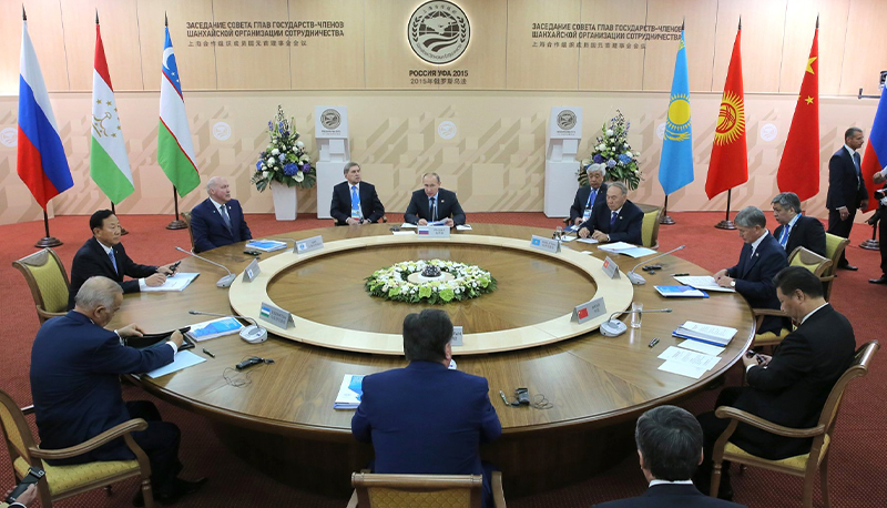 Meeting of the Council of Heads of State of the Shanghai Cooperation Organization (SCO) around a circular table.