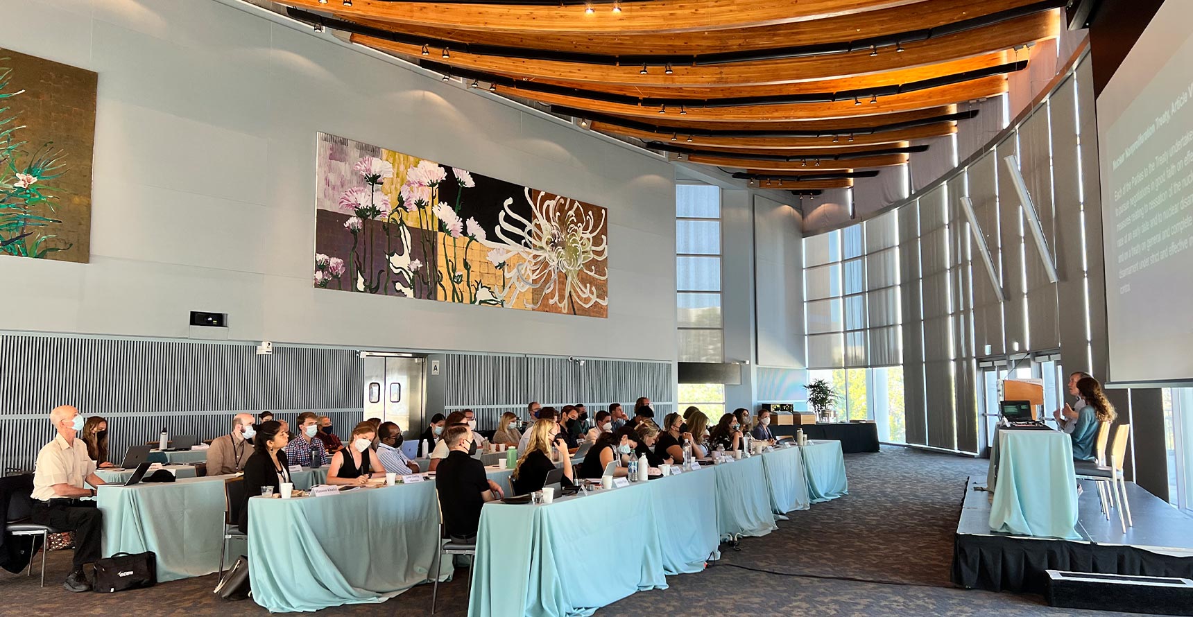 The Great Hall at UC San Diego, with the 2022 Public Policy and Nuclear Threats cohort listening to a panel. There are three rows of attendees.