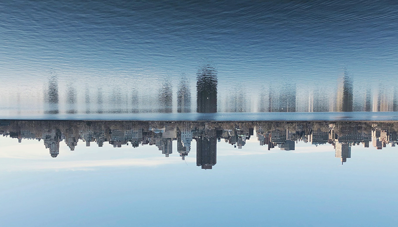 A photo of New York City skyline upside down reflecting in the water