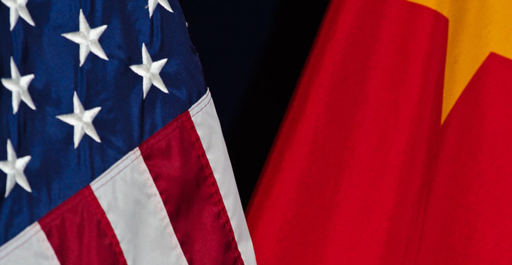 close-up photos of the flags of the United States and China side-by-side