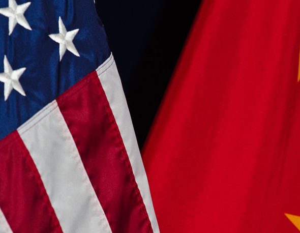 close-up photo of the United States and China national flags side-by-side