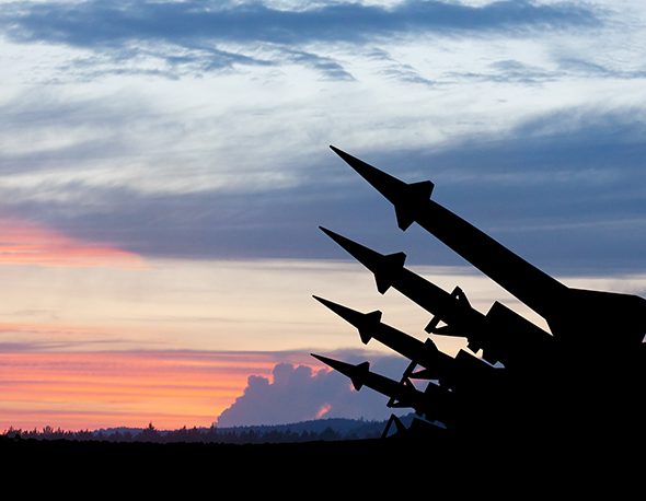 Image of nuclear weapons with sunset in background