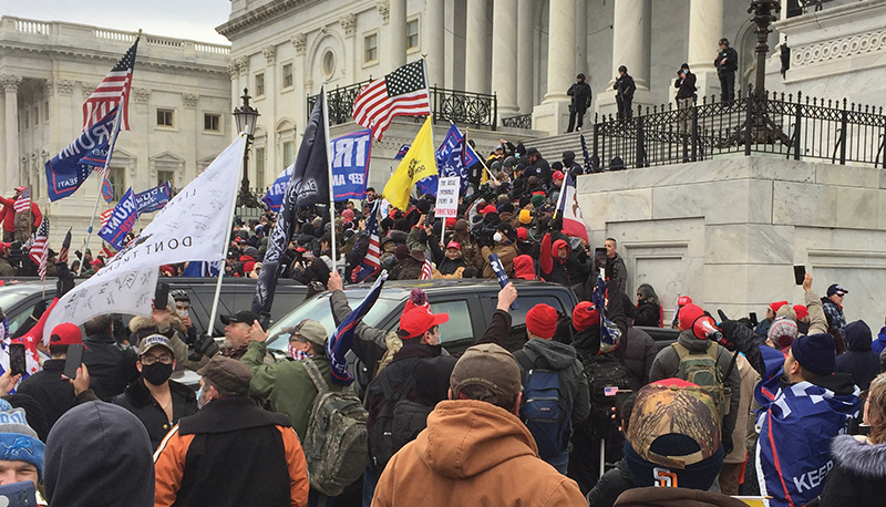 Protestors gather on the steps outside the US Capitol building on January 6, 2021.