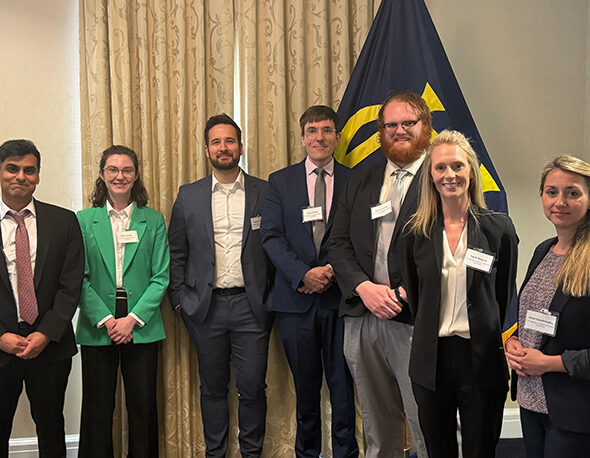 The 2024-25 IGCC Postdoctoral Fellows with program director Neil Narang at the 2025 IGCC Postdoc Annual Conference in Washington, D.C.