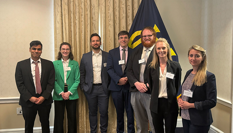 The 2024-25 IGCC Postdoctoral Fellows with program director Neil Narang at the 2025 IGCC Postdoc Annual Conference in Washington, D.C.