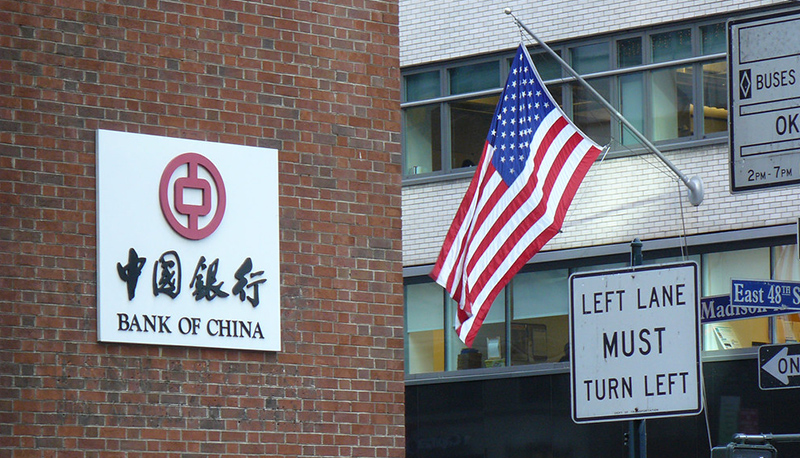 Image of the China Bank in New York City with an American flag flying nearby.
