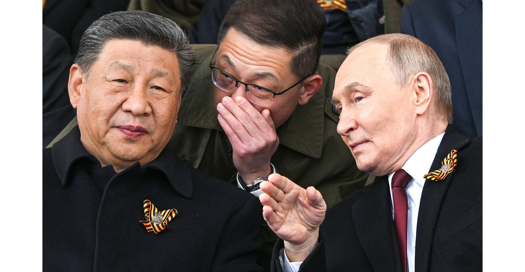 Vladimir Putin and Xi Jinping speak closely to one another