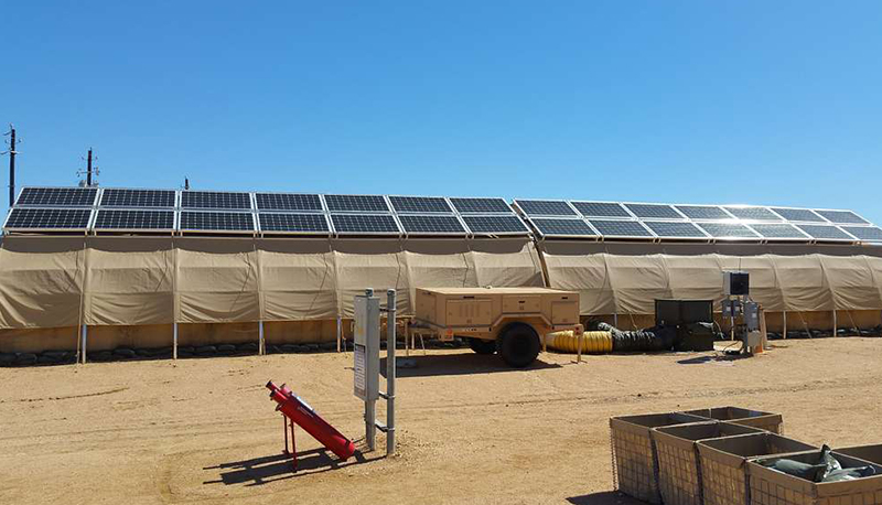 A U.S. Air Force expeditionary energy demonstration with a solar panel microgrid system atop a tent.