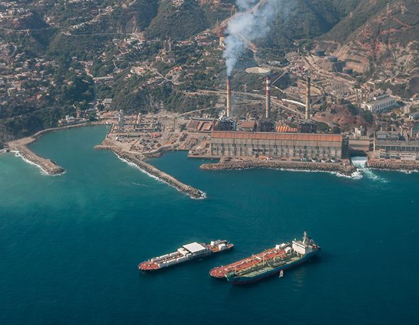 Aerial view of commercial ships and an electrical plant off Venezuela's Maiquetía coast