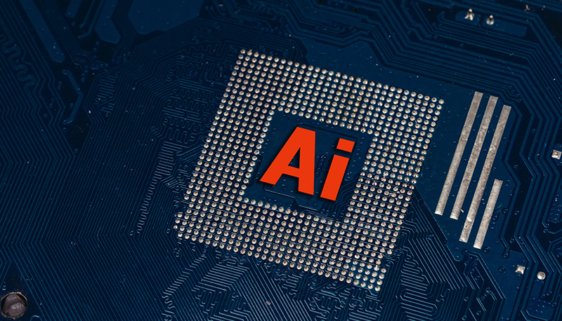 Concept art of a computer chip with "AI" written on it