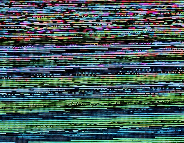 Photo of static on a digital screen.