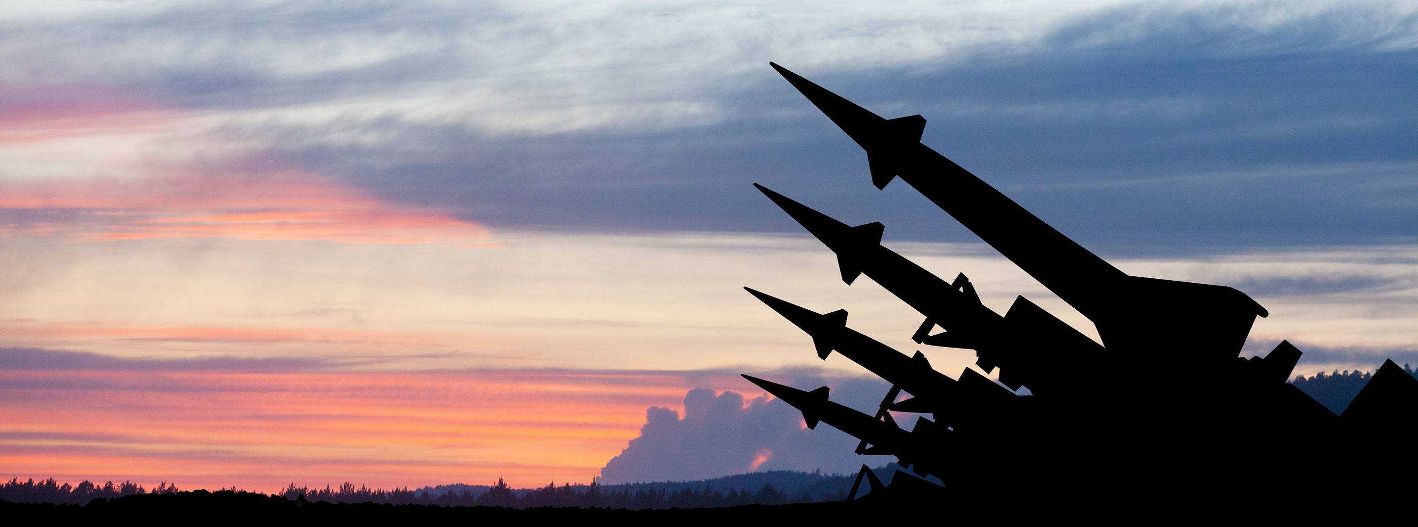 Image of nuclear weapons with sunset in background