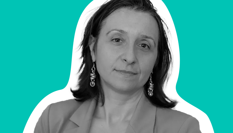 Black and white headshot of Francesca Giovannini on a teal background