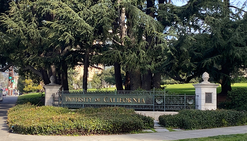 Photograph of the "University of California" sign at an entrance to the UC Berkeley campus